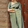 Blissful Dark Green Soft Silk Saree With Sizzling Blouse Piece