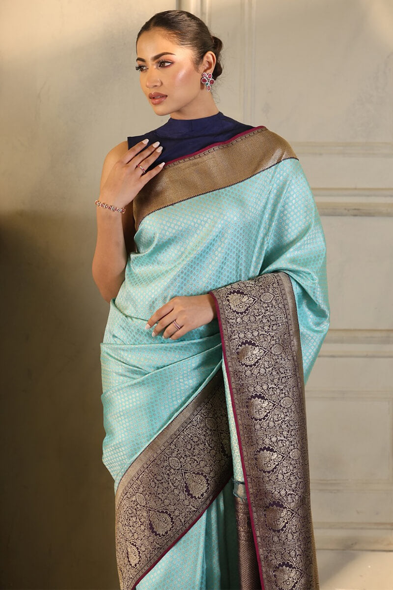 Enigmatic Firozi Soft Silk Saree With Glittering Blouse Piece