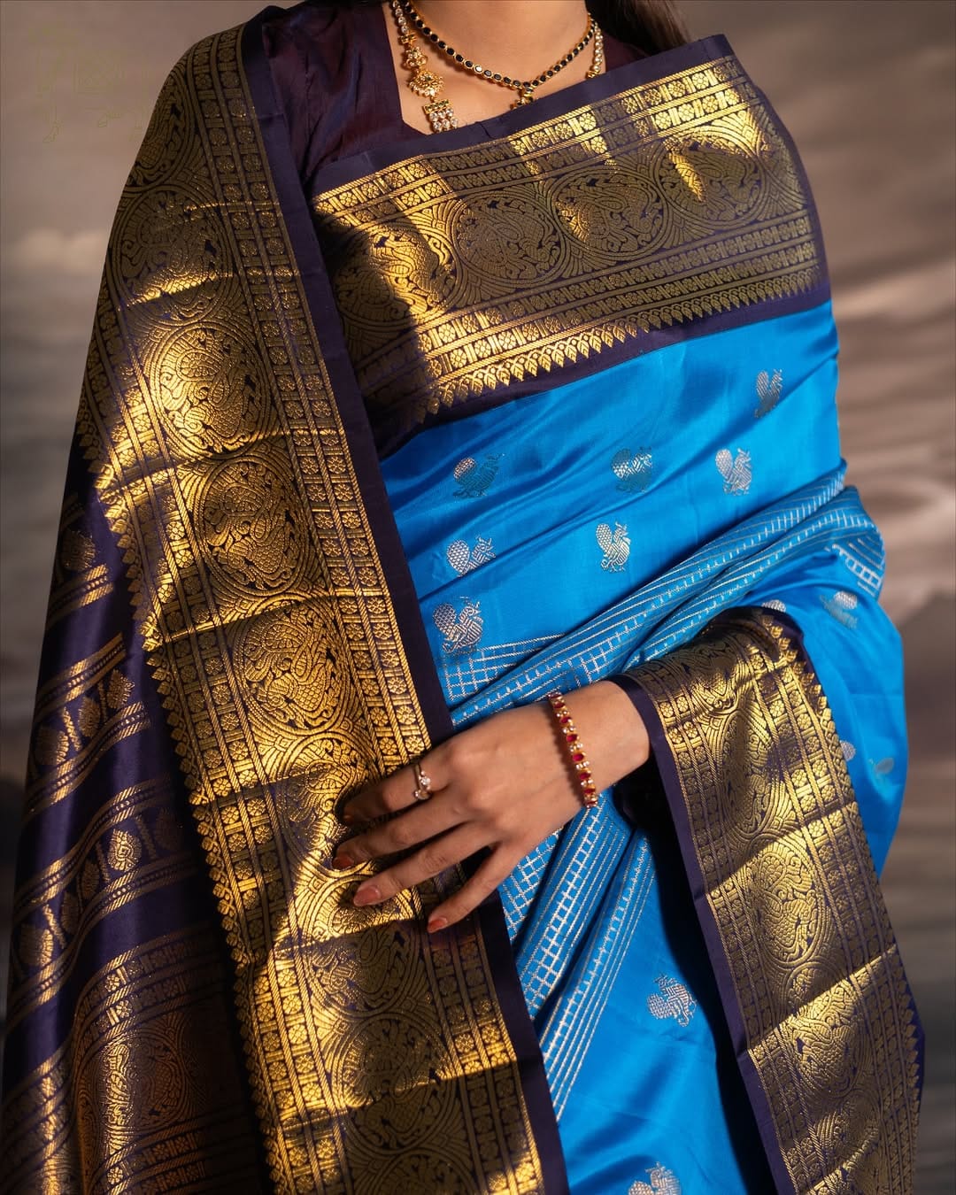 Majestic Firozi Soft Silk Saree With Luminous Blouse Piece