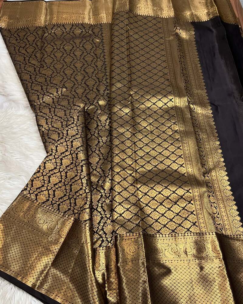 Sizzling Black Soft Banarasi Silk Saree With Alluring Blouse Piece