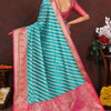 Enticing Firozi Soft Banarasi Silk Saree With Twirling Blouse Piece