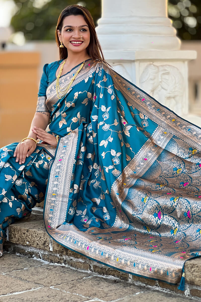 Ineffable Teal Blue Soft Banarasi Silk Saree With Zephyr Blouse Piece