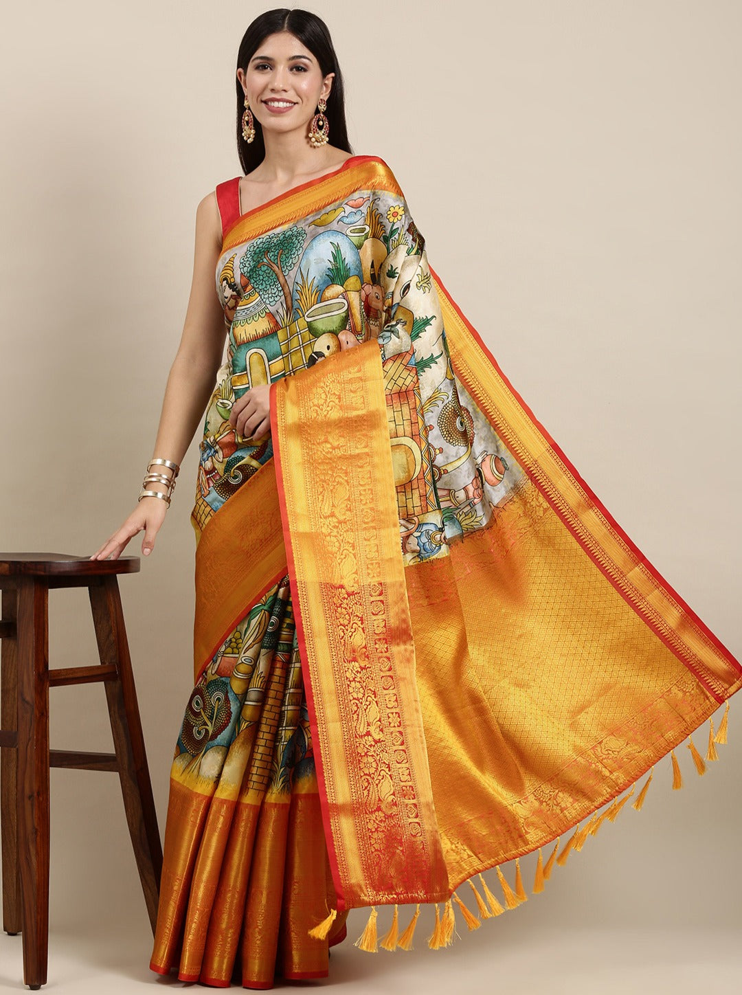 Staring Beige Kalamkari Printed Saree With Stylish Blouse Piece