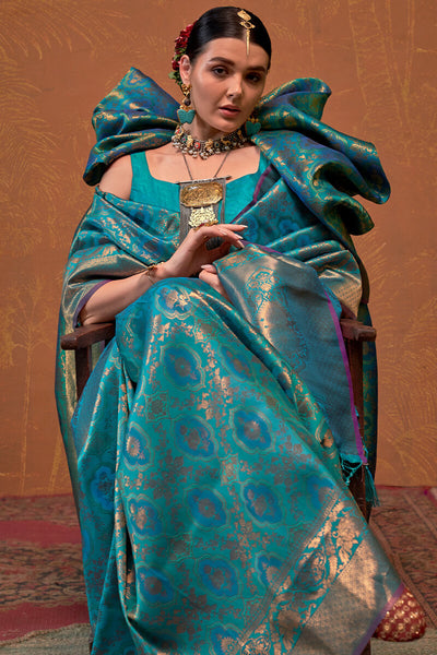 Precious Firozi Kanjivaram Silk Saree With Gleaming Blouse Piece