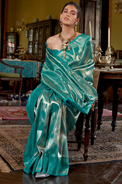 Stunner Turquoise Kanjivaram Silk Saree With Luminous Blouse Piece
