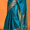 Susurrous Teal Blue Soft Banarasi Silk Saree With Embellished Blouse Piece