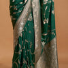Exuberant Dark Green Georgette Banarasi Silk Saree With Piquant Blouse Piece
