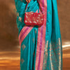 Glowing Firozi Soft Banarasi Silk Saree With Eye-catching Blouse