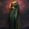 Adorning Dark Green Soft Silk Saree With Prominent Blouse Piece