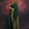 Adorning Dark Green Soft Silk Saree With Prominent Blouse Piece