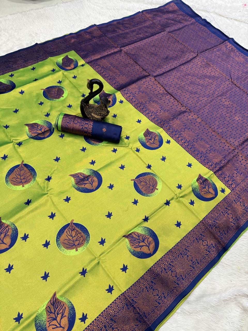 Enigmatic Parrot Soft Silk Saree With Bewitching Blouse Piece