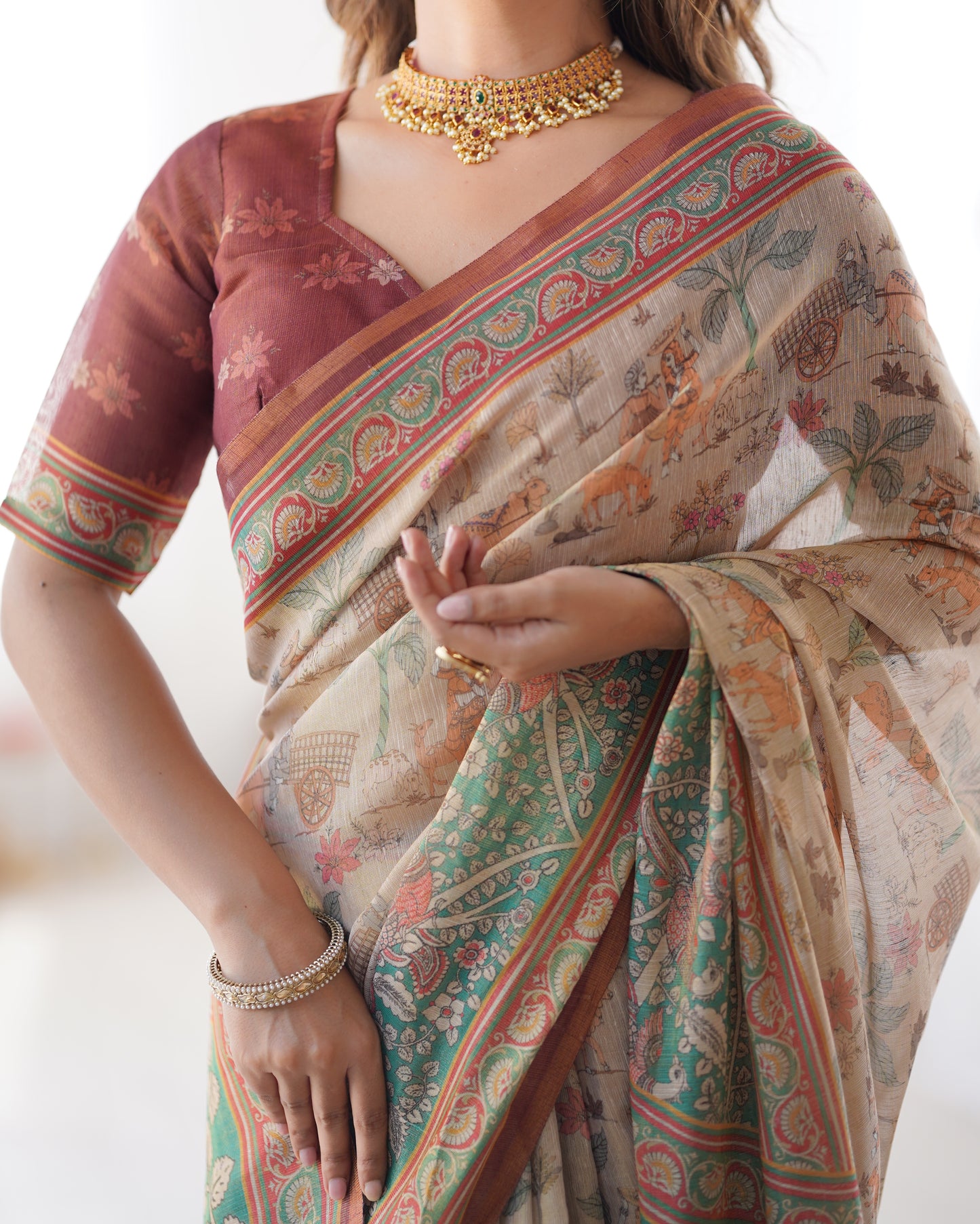 Classic Beige Linen Saree with Teal Green Heritage Border & Traditional Story Print Detailing | Premium Cultural & Festive Wear