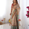 Classic Beige Linen Saree with Teal Green Heritage Border & Traditional Story Print Detailing | Premium Cultural & Festive Wear
