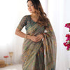Earthy Olive Brown Linen Saree with Teal Green Heritage Border & Artistic Elephant Motif Prints | Premium Cultural & Festive Wear