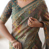 Earthy Olive Brown Linen Saree with Teal Green Heritage Border & Artistic Elephant Motif Prints | Premium Cultural & Festive Wear