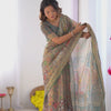 Earthy Olive Brown Linen Saree with Teal Green Heritage Border & Artistic Elephant Motif Prints | Premium Cultural & Festive Wear